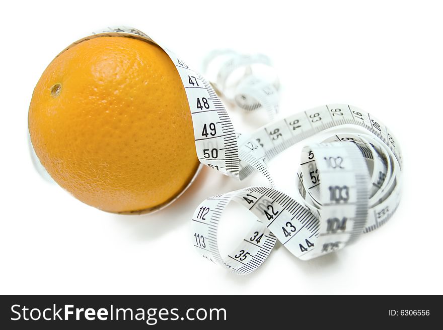 Orange entangled with measuring tape - abstract healthy food symbol. Orange entangled with measuring tape - abstract healthy food symbol