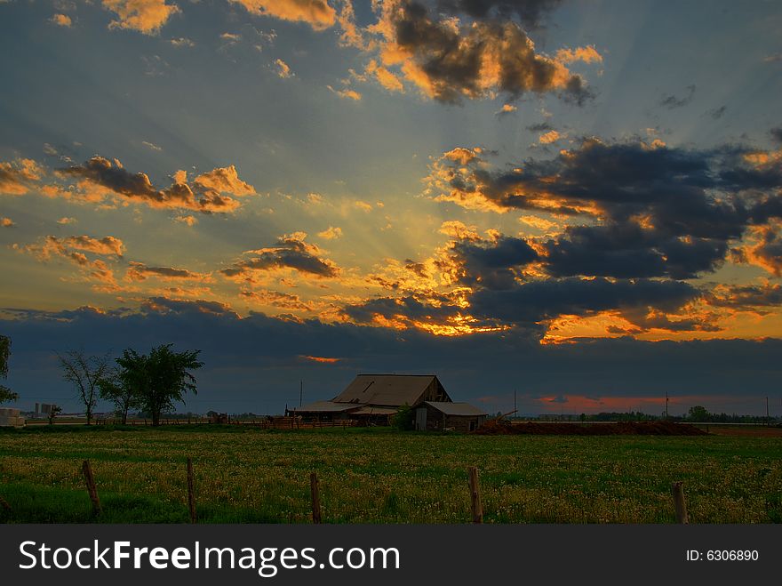 Beaming Sunset Over Rustic Barn