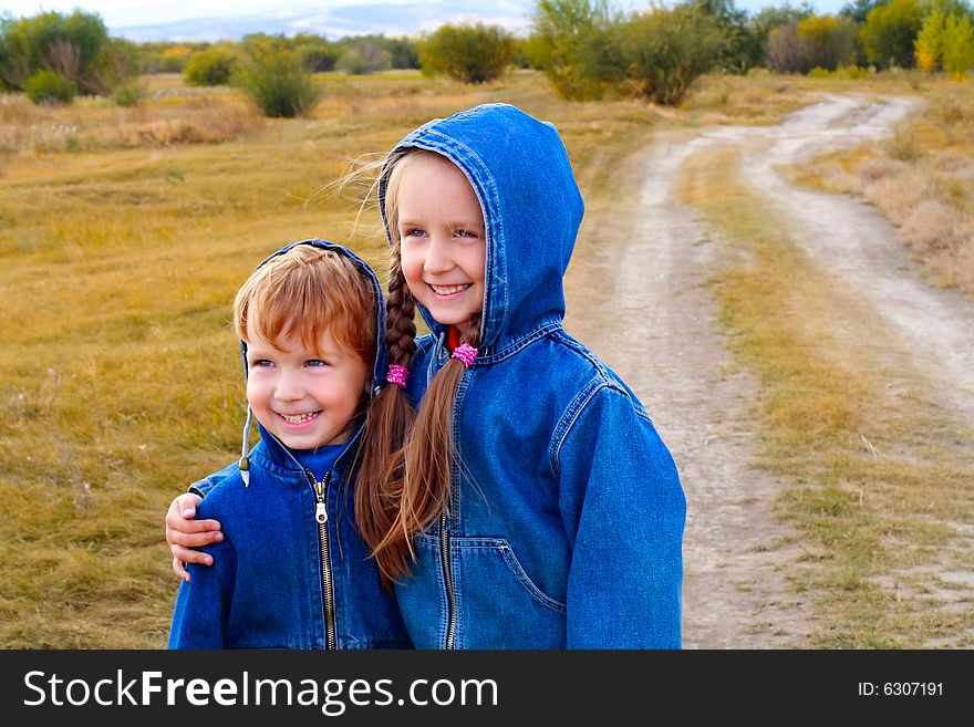 Girl and boy standing or running on the road