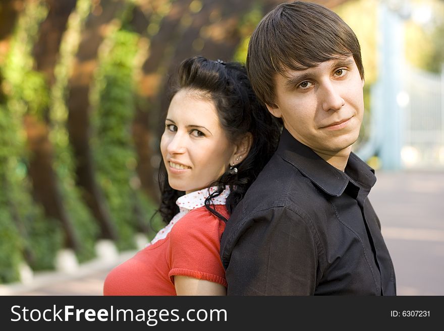 Outdoor portrait of young happy attractive couple together