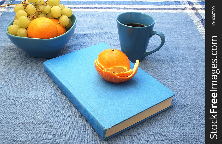 Blue book and fruit