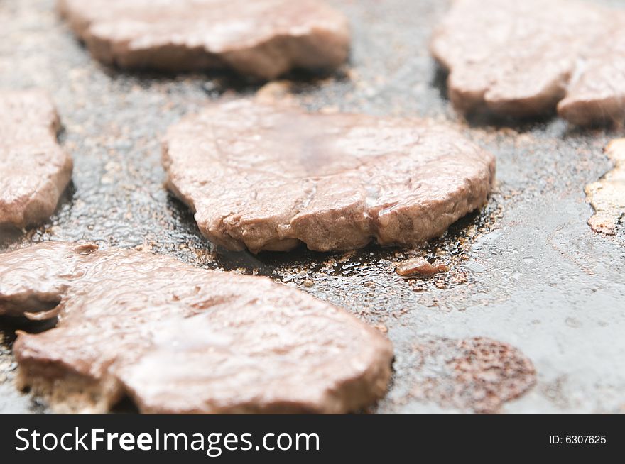 Meat Cooking In A Hot Stone