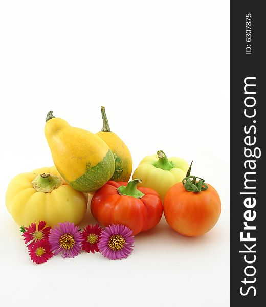 Flowers and vegetables, healthy food, isolated over white.