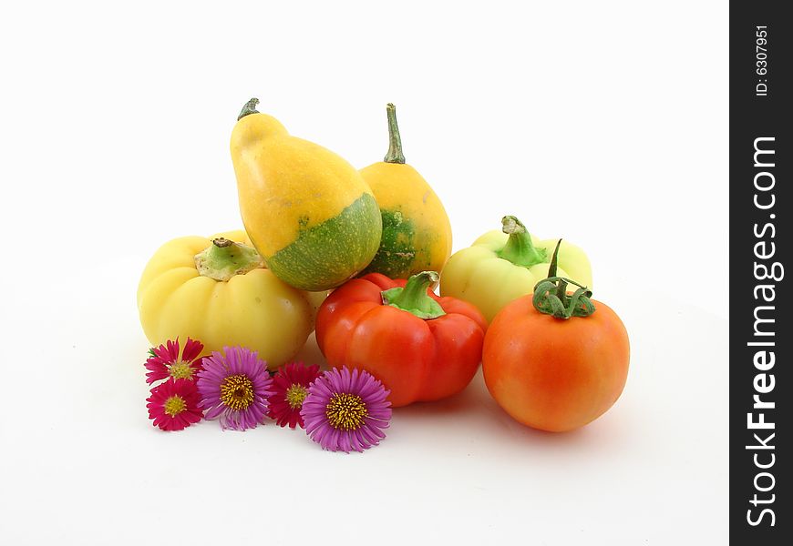 Vegetables and flowers isolated over white background