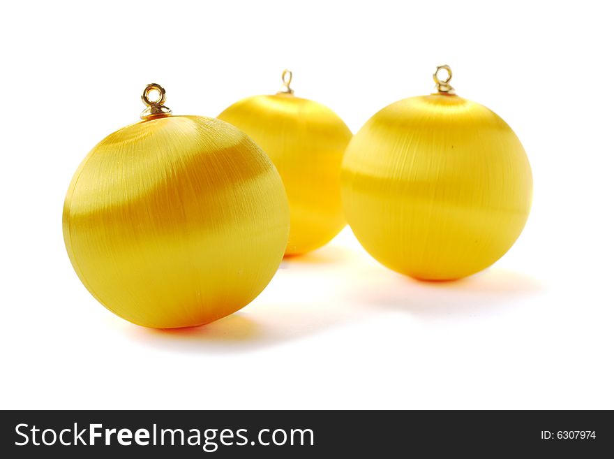Yellow christmas balls isolated on white