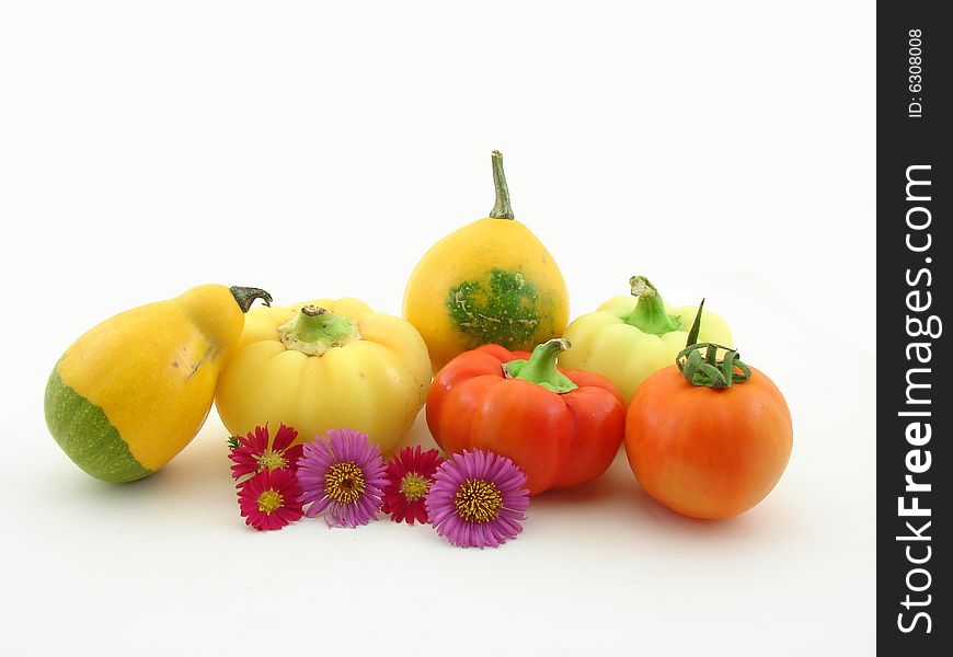 Vegetables and flowers isolated over white background