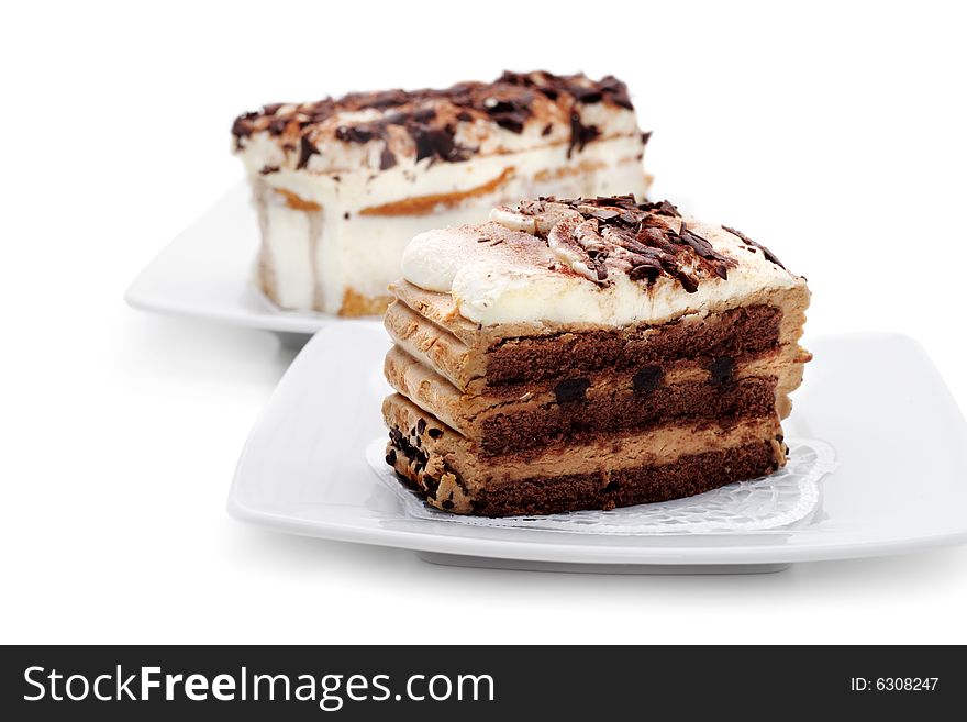 Two Chocolate Cheesecake. Selective Focus. Isolated on White Background. Two Chocolate Cheesecake. Selective Focus. Isolated on White Background