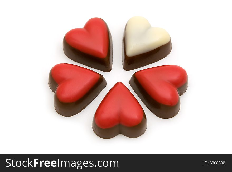 Chocolate red and white hearts on white background