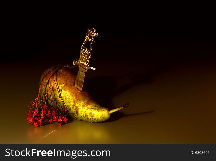 Photo of the pears with knife and the ashberry twig. Photo of the pears with knife and the ashberry twig