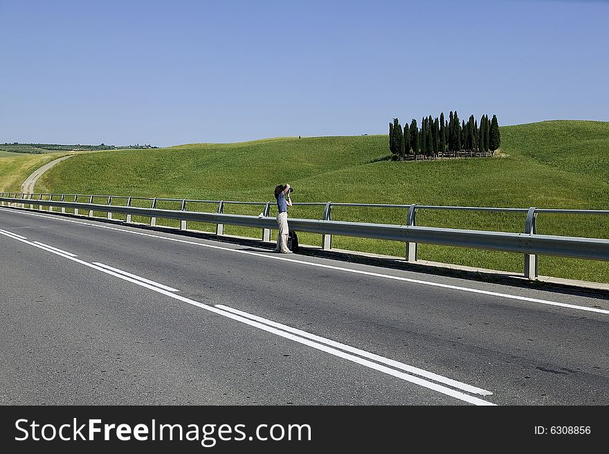 TUSCANY countryside with cypress and road