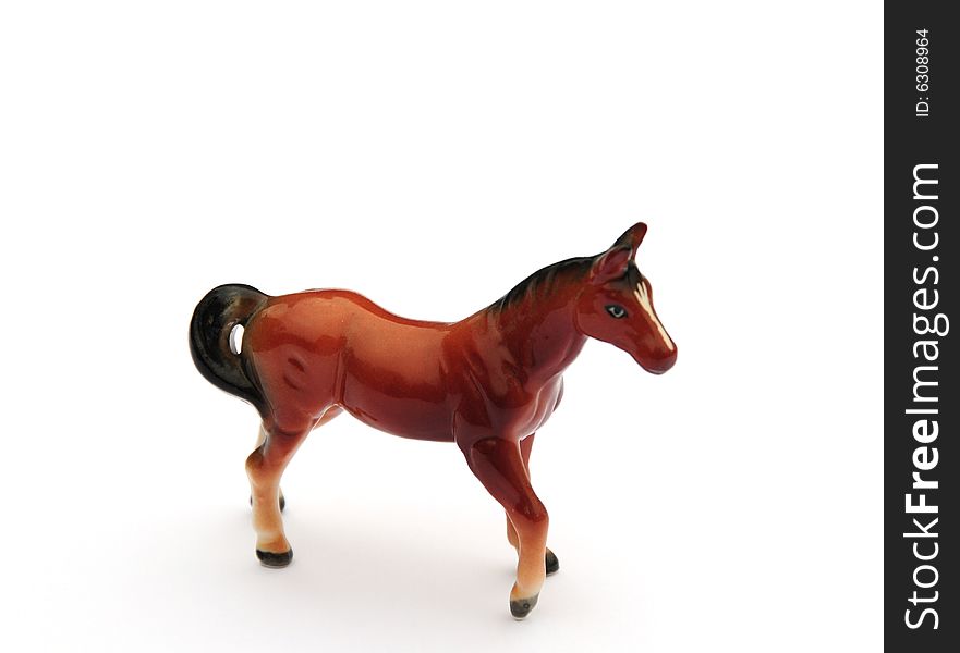 Shot of a small china horse on white