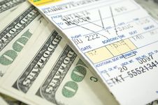 Airplane Ticket And Dollars Royalty Free Stock Image