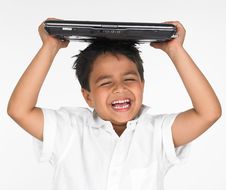 Boy Holding Laptop On His Head Royalty Free Stock Images Boy Holding Laptop On His Head Royalty Free Stock Images