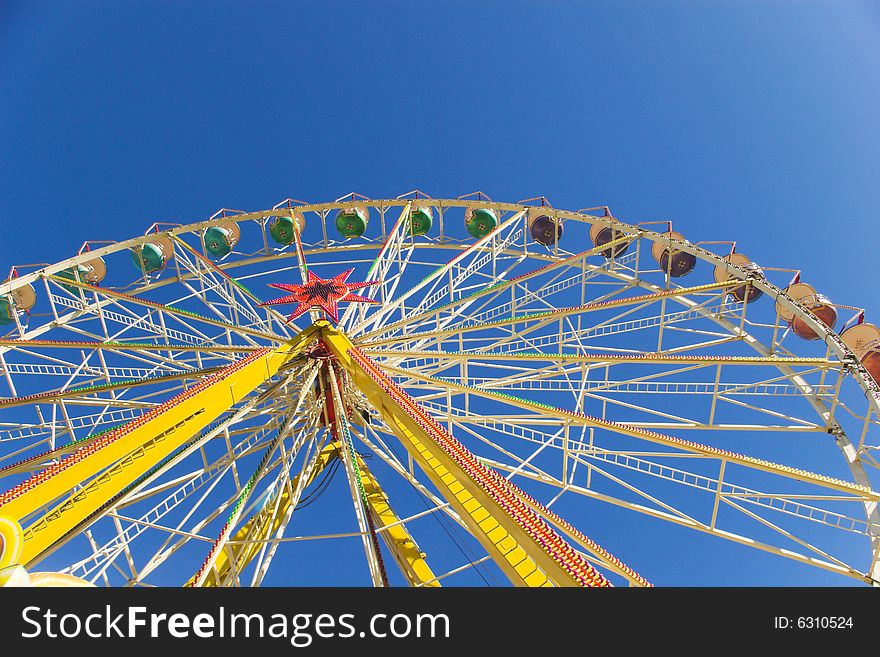 Blue sky and observation wheel