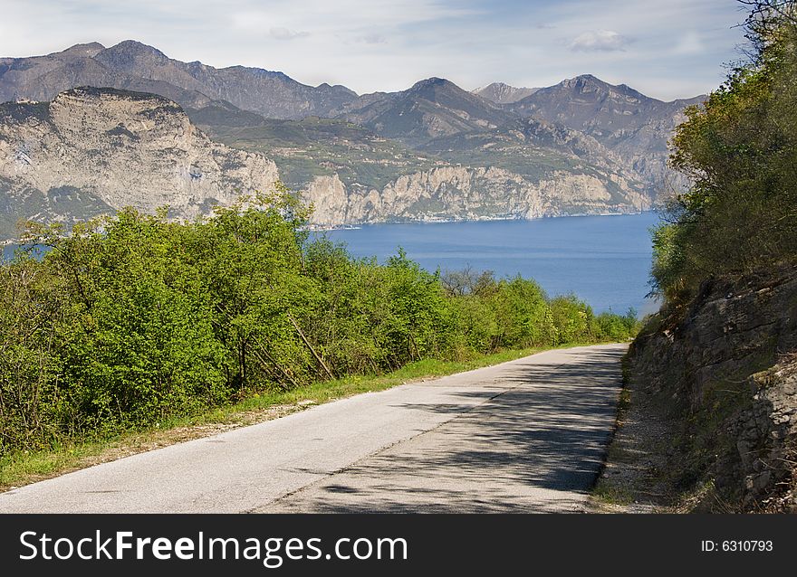 Desert street towards the Garda Lake in Italy. Desert street towards the Garda Lake in Italy