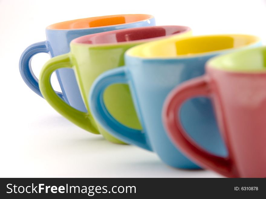 Detail of four colored coffee cups. Detail of four colored coffee cups