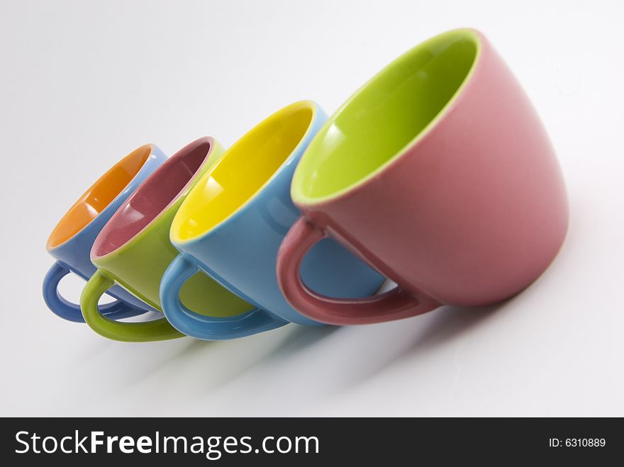 Detail of four colored coffee cups. Detail of four colored coffee cups