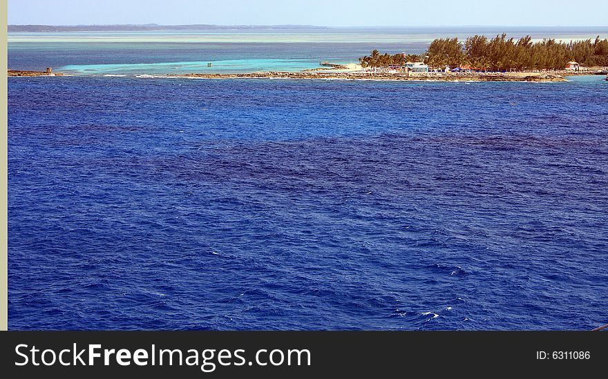 View of a exotic  island from the cruise ship in the bahamas caribbean. View of a exotic  island from the cruise ship in the bahamas caribbean