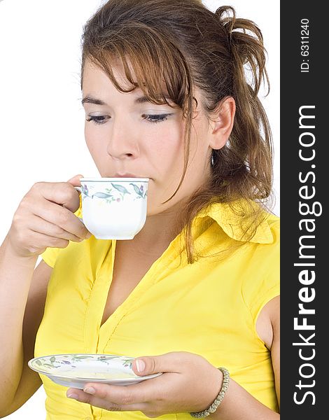 The portrait of girl with a mug of coffee isolated on white background