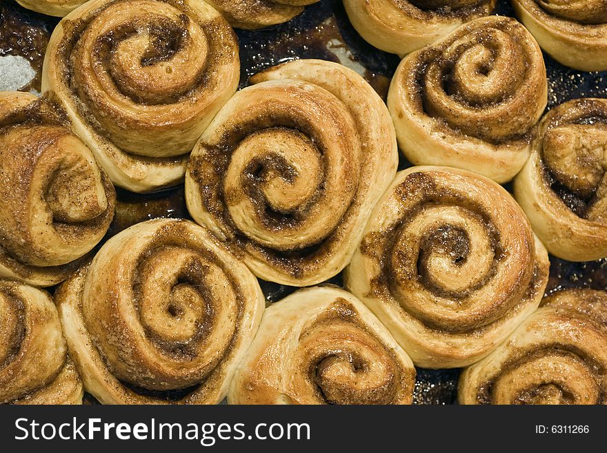 Cinnamon buns in a baking dish fresh from the oven