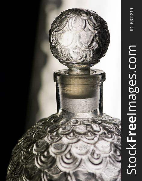 Glass bottle of perfume, seduction and fashion concept. Glass bottle of perfume, seduction and fashion concept