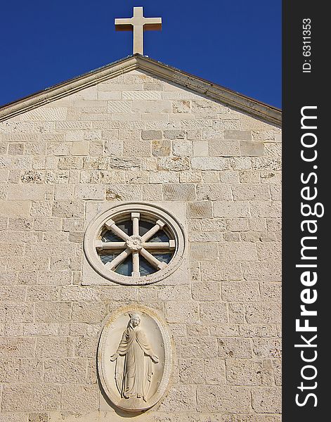 Belltower  on a background of the blue sky.