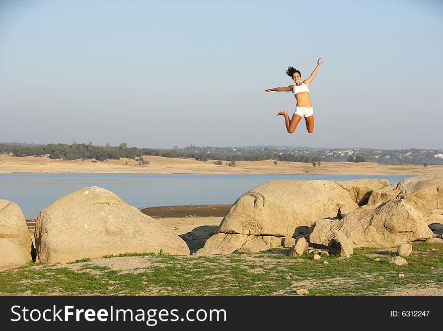 A woman jumps for joy