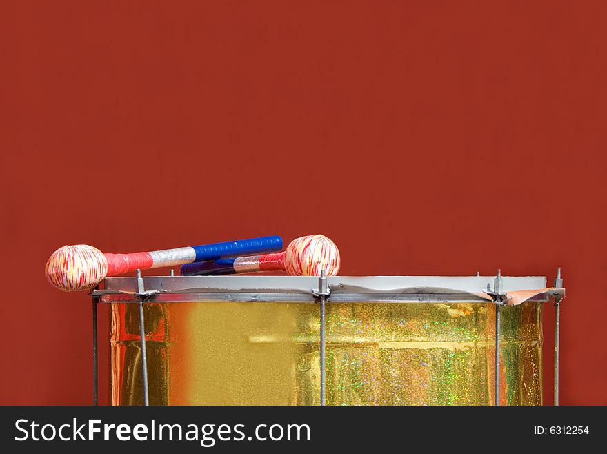 Drum on light red baskground.