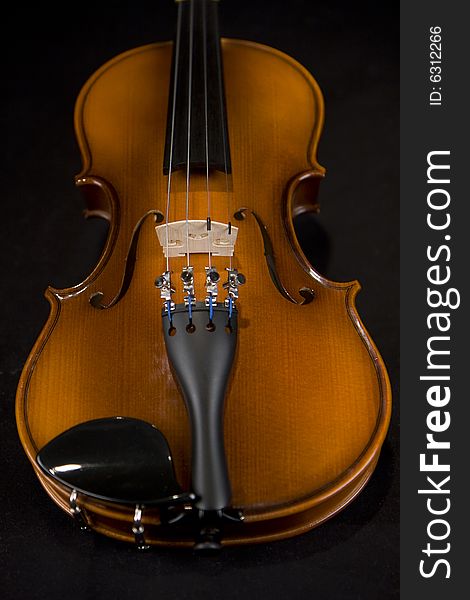 This beautiful violin has been captured as a gorgeous symbol of symphony and music. This beautiful violin has been captured as a gorgeous symbol of symphony and music.