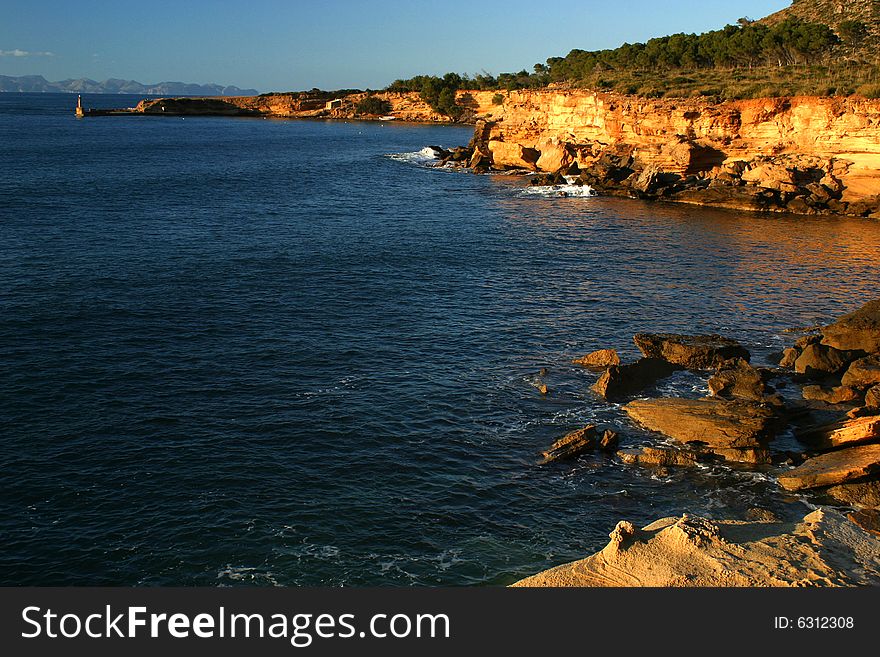 Panoramic view to the lighthouse and the other side of a bay in Majorca in Spain