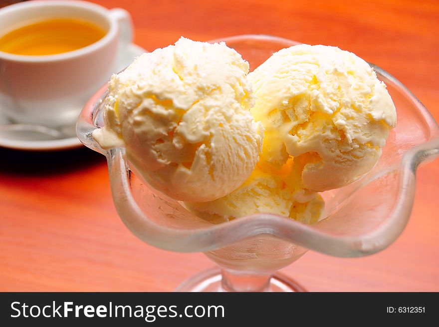 Close-up of cup of tea and ice cream, shallow DOF. Close-up of cup of tea and ice cream, shallow DOF