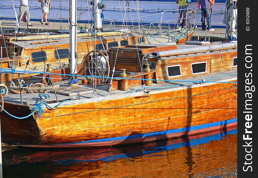 The wooden sailing boat in harbour - close up. The wooden sailing boat in harbour - close up.