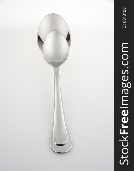 Lustrous spoon on light plane