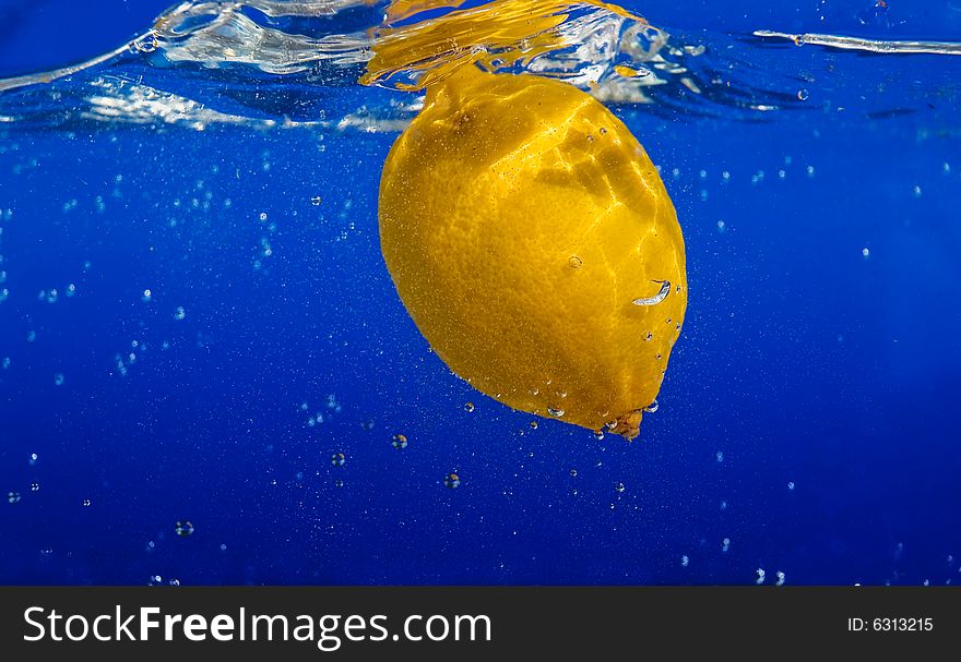 A fresh lemon in the water