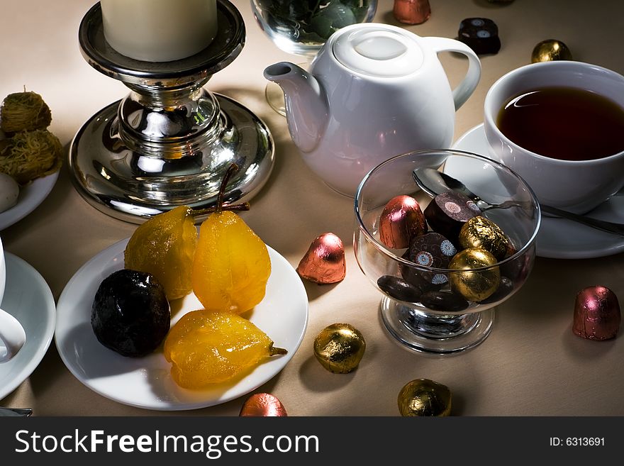 Cup of tea and sweet on a table