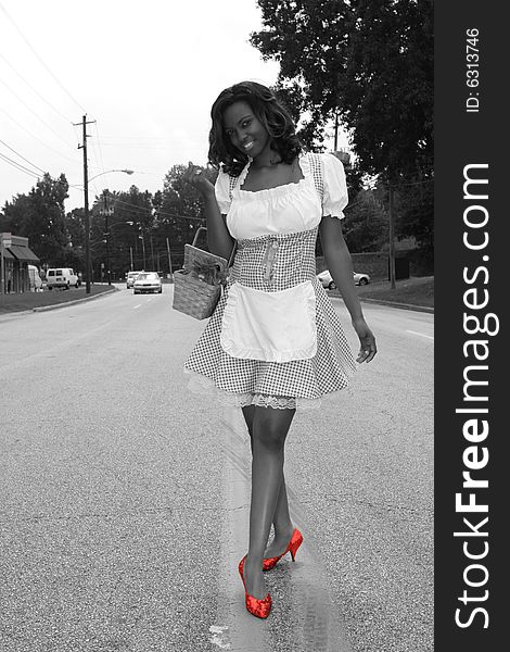 Modern Day Dorothy, desaturated with red ruby shoes. Modern Day Dorothy, desaturated with red ruby shoes