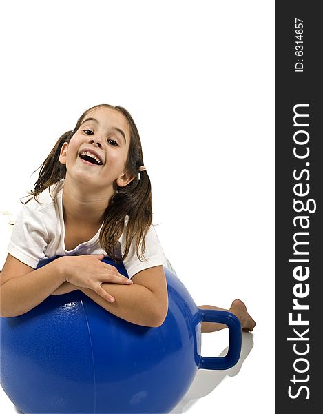 Young girl on a  blue space hopper isolated on white. Young girl on a  blue space hopper isolated on white