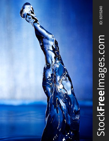 Water drop with blue background and blue surroundings. Water drop with blue background and blue surroundings