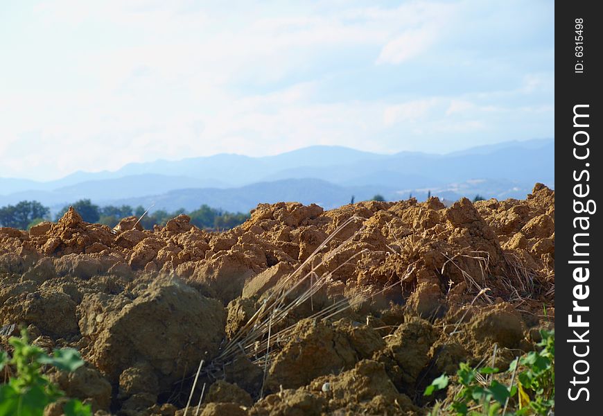 A suggestive shot of clods in a Tuscany landscape