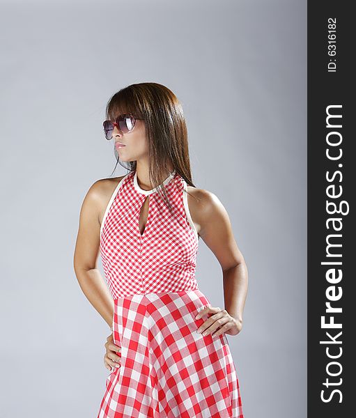 Fashion shot of a beautiful hispanic lady dressed in red. Fashion shot of a beautiful hispanic lady dressed in red