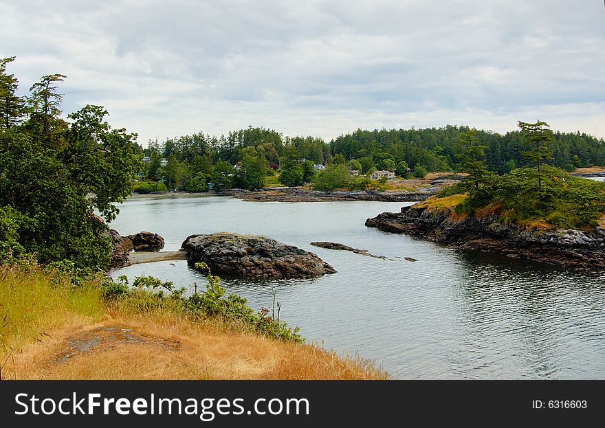 Rocky coast with islands in summer day