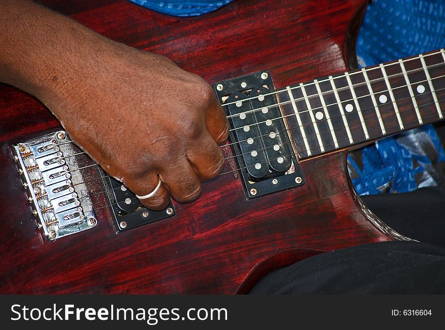 Afro-american playing the guitar. Afro-american playing the guitar