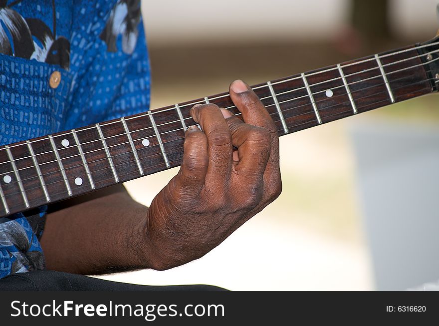 Afro-american playing the guitar. Afro-american playing the guitar