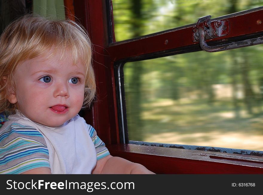One year old boy on his first train trip. One year old boy on his first train trip