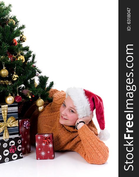 Happy girl by the Christmas tree on white background. Happy girl by the Christmas tree on white background