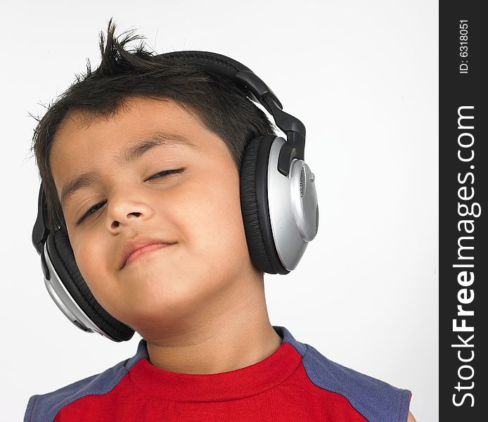 Asian boy with headphones smiling