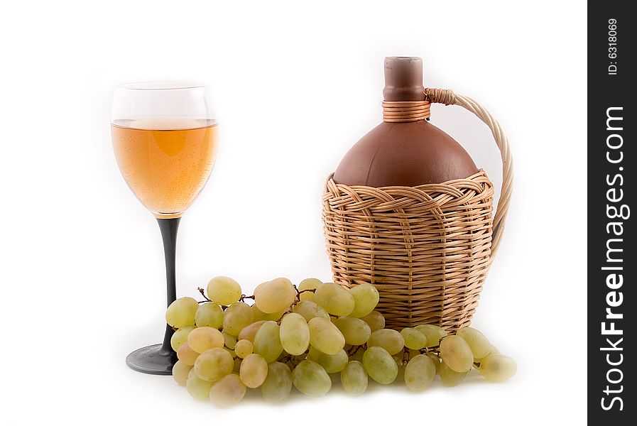 Bottle 
fault in a yellow basket and grapes on a white background