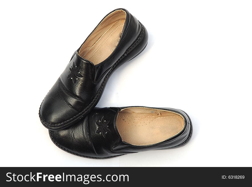 The pair of  old leather shoes with shiny vamp on white background.