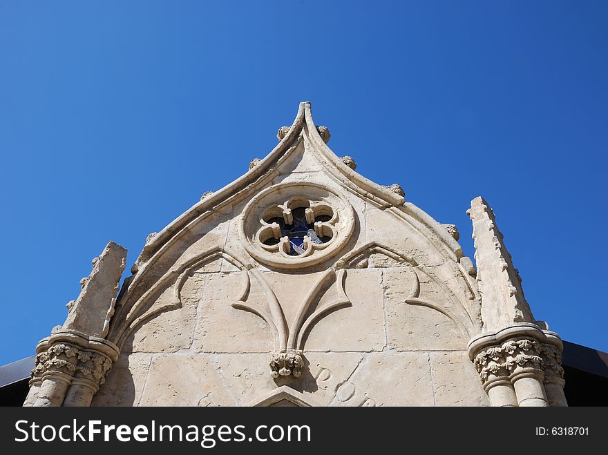 White Chapel Wall Against Blue Sky