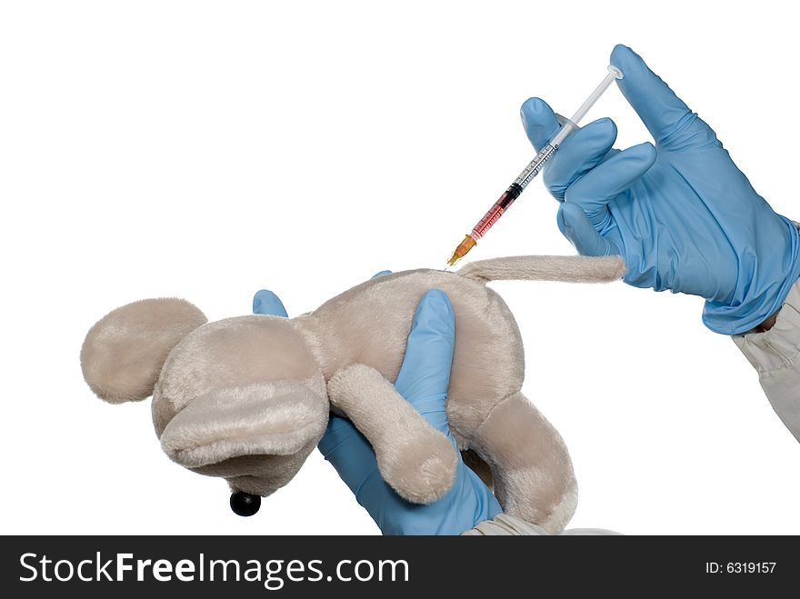 A teddy bunny is getting an injection isolated on white